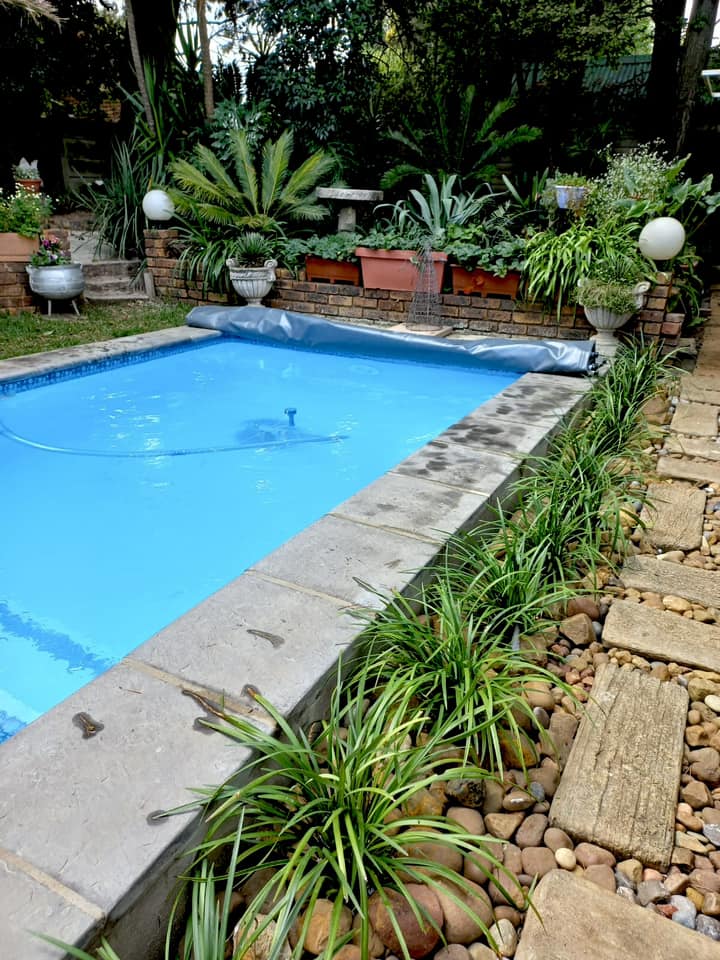 Fiberglass pool in tropical garden